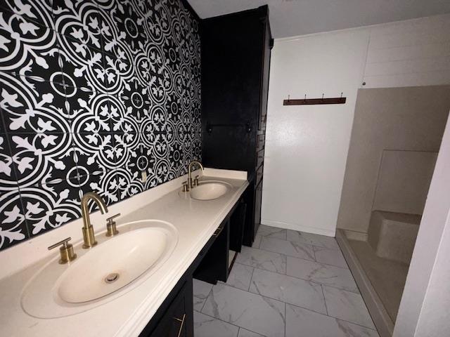 176 Ridgewood St, Bridge City, TX 77611 - full bathroom featuring marble finish floors and double vanity