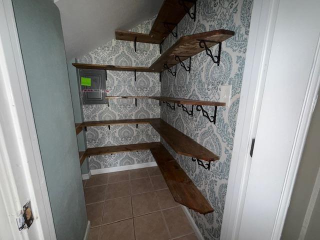 176 Ridgewood St, Bridge City, TX 77611 - staircase with wallpapered walls and tile patterned flooring