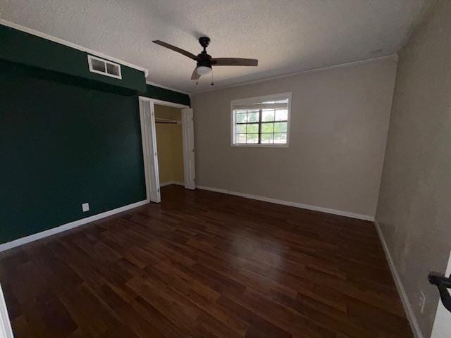 176 Ridgewood St, Bridge City, TX 77611 - unfurnished bedroom with a textured ceiling, wood finished floors, a closet, ceiling fan, and crown molding