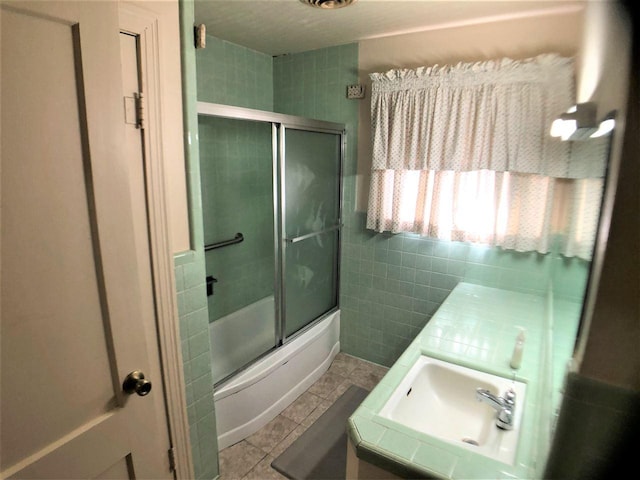 3812 30th, Port Arthur, TX 77642 - full bath with tile walls, tile patterned flooring, enclosed tub / shower combo, and vanity