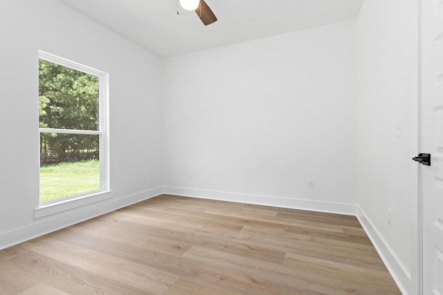 spare room featuring ceiling fan and light hardwood / wood-style flooring