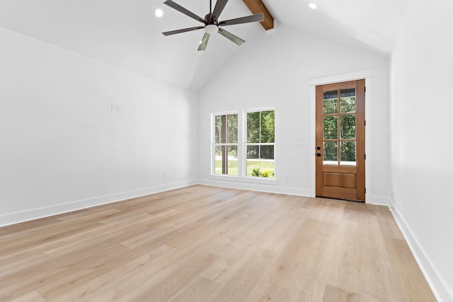 interior space with ceiling fan, beamed ceiling, high vaulted ceiling, and light wood-type flooring