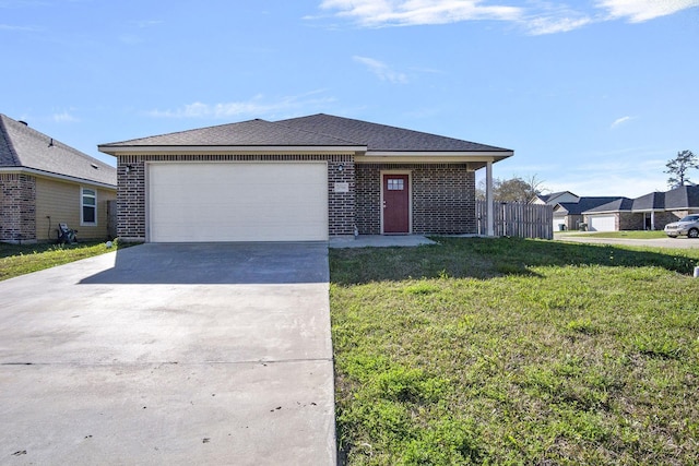 view of front of property with brick siding, concrete driveway, a front yard, roof with shingles, and an attached garage