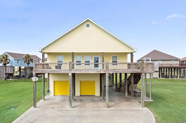 back of property with a porch, a garage, and a yard