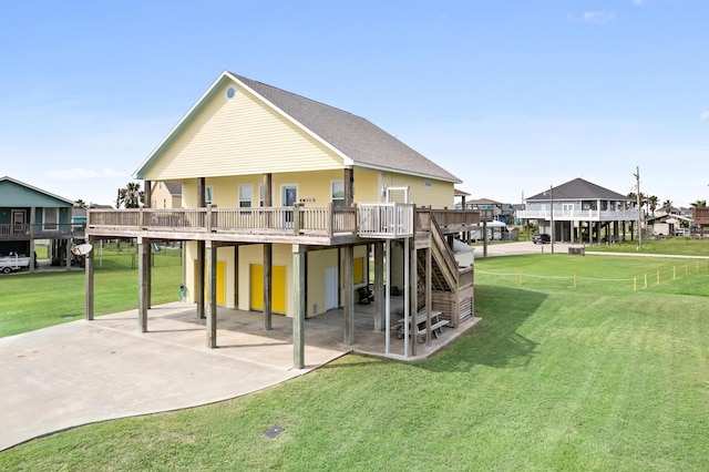 back of property featuring a yard and a deck