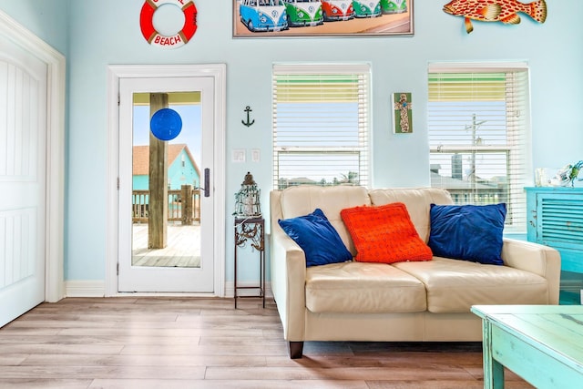 sitting room with a wealth of natural light and light wood-type flooring