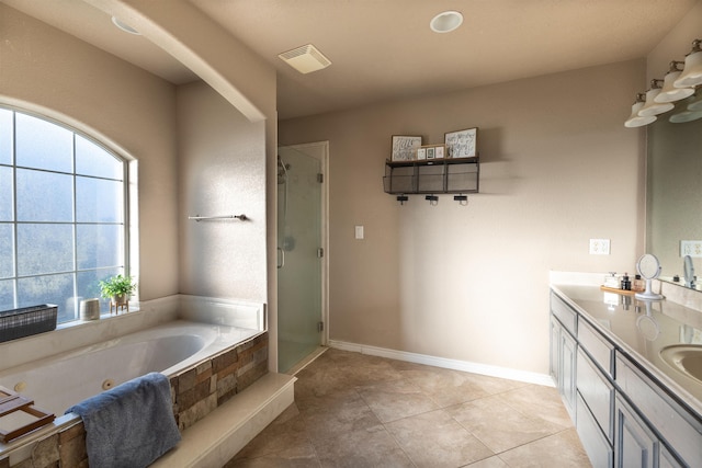 735 Jacob Cir, Orange, TX 77630 - bathroom with a shower stall, a whirlpool tub, double vanity, tile patterned flooring, and baseboards