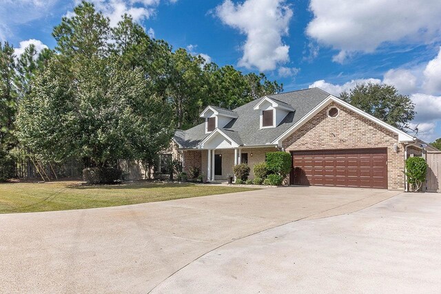 view of front facade featuring a front yard and a garage