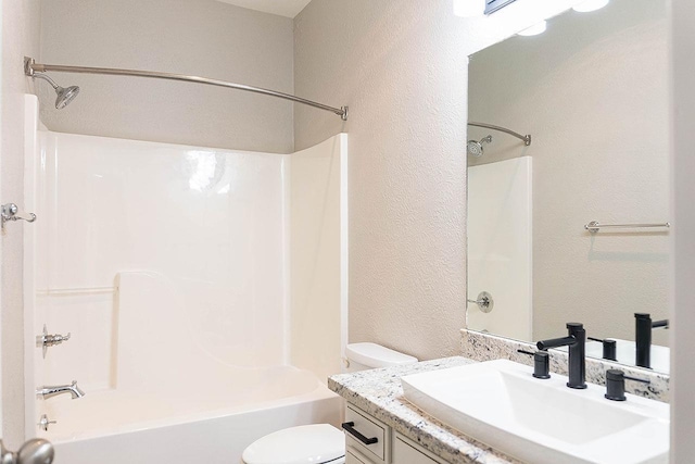 full bathroom featuring vanity, shower / bath combination, and toilet