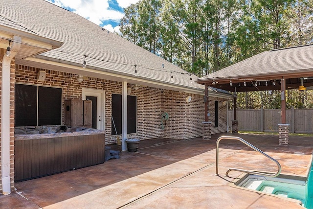 view of patio with a hot tub