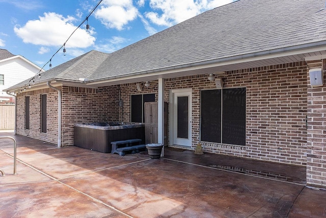 view of patio / terrace featuring a hot tub