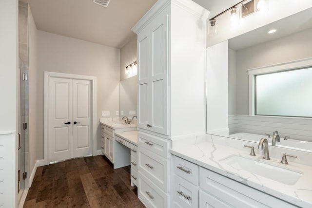 bathroom featuring vanity, wood-type flooring, and independent shower and bath