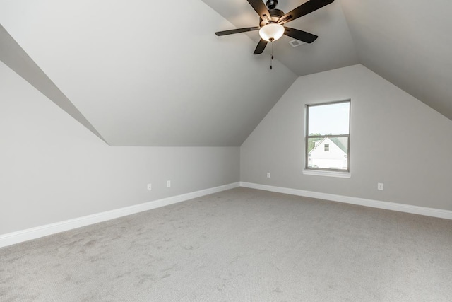 additional living space with carpet floors, ceiling fan, and lofted ceiling