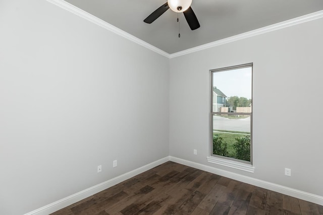 unfurnished room featuring ornamental molding, a wealth of natural light, dark wood-type flooring, and ceiling fan