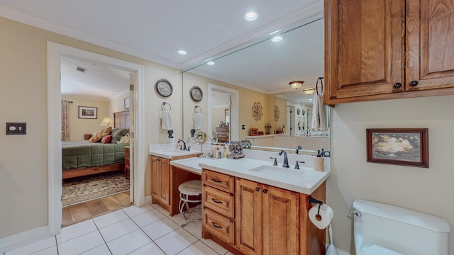 310 Junker Rd, Beaumont, TX 77707 - ensuite bathroom with ornamental molding, vanity, toilet, tile patterned floors, and recessed lighting