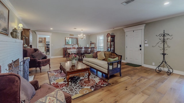 310 Junker Rd, Beaumont, TX 77707 - living area with a chandelier, ornamental molding, light wood-type flooring, baseboards, and recessed lighting