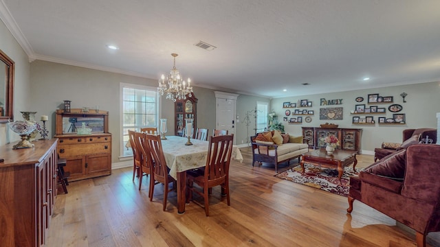 310 Junker Rd, Beaumont, TX 77707 - dining room with a chandelier, light wood-type flooring, crown molding, recessed lighting, and baseboards