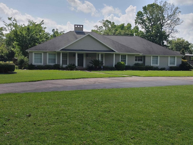 310 Junker Rd, Beaumont, TX 77707 - view of front facade with a front lawn and a porch
