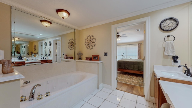 310 Junker Rd, Beaumont, TX 77707 - bathroom featuring a tub with jets, ornamental molding, tile patterned flooring, vanity, and ceiling fan