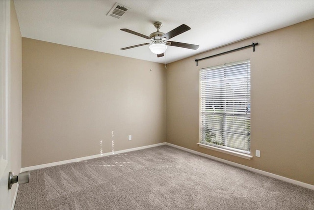 unfurnished room featuring carpet and ceiling fan