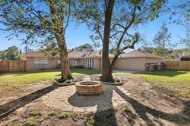 view of yard with a patio area and an outdoor fire pit