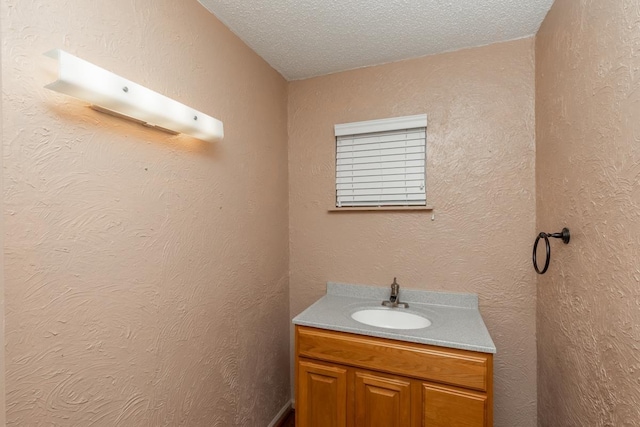 10754 Bonwell Loop, Kountze, TX 77625 - bathroom featuring vanity and a textured ceiling