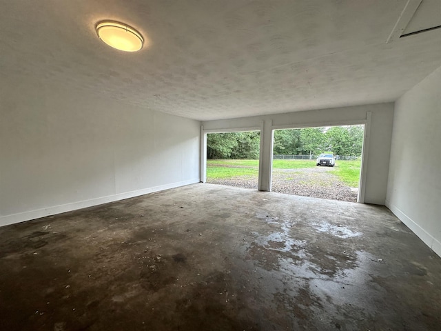 garage featuring baseboards