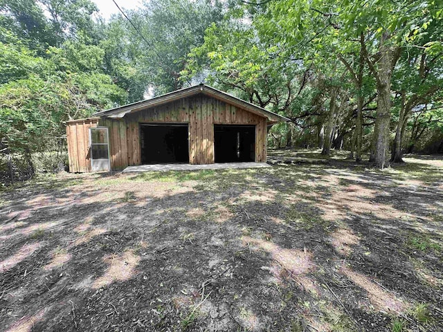 view of outdoor structure with an outdoor structure and a wooded view