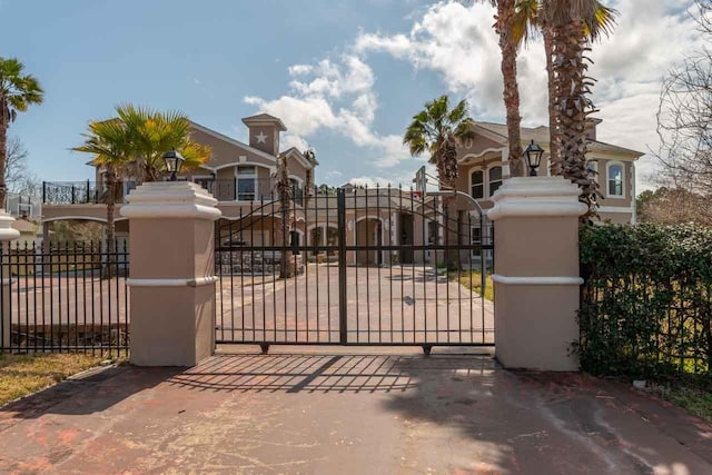 view of gate featuring fence