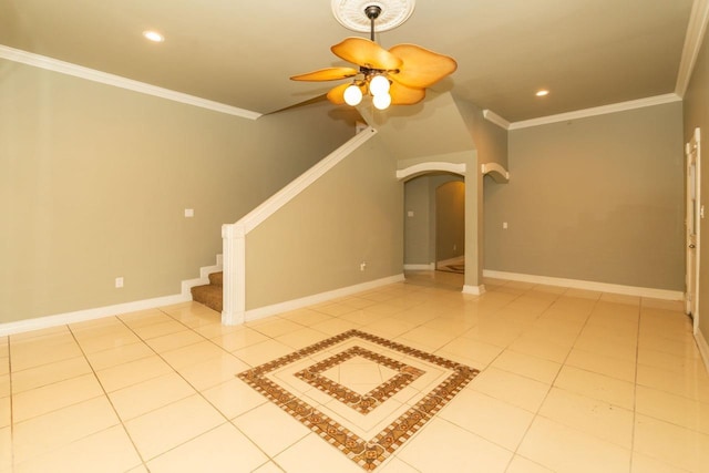 unfurnished living room featuring light tile patterned floors, stairway, arched walkways, and crown molding