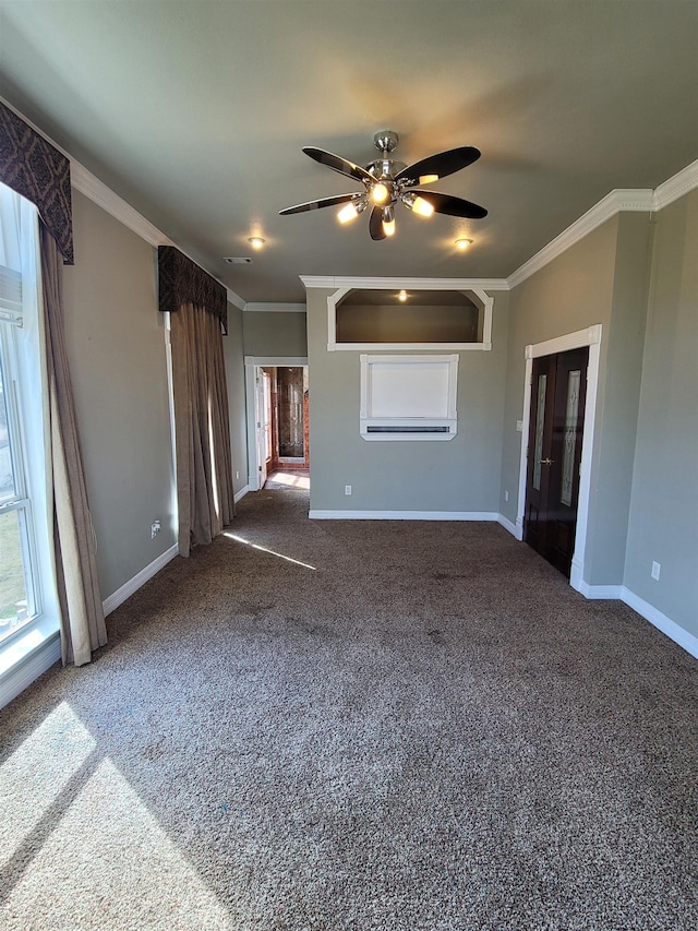 unfurnished living room featuring crown molding, a ceiling fan, baseboards, and carpet floors