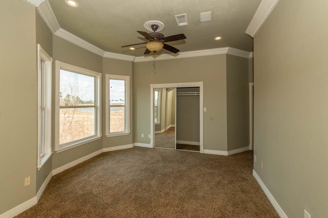 unfurnished bedroom featuring baseboards, carpet, and ornamental molding