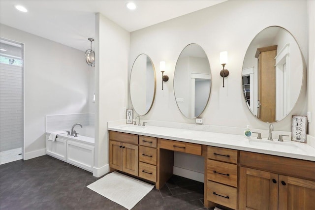 full bath featuring double vanity, a garden tub, recessed lighting, and a sink