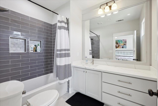 ensuite bathroom with visible vents, connected bathroom, toilet, vanity, and shower / bathtub combination with curtain