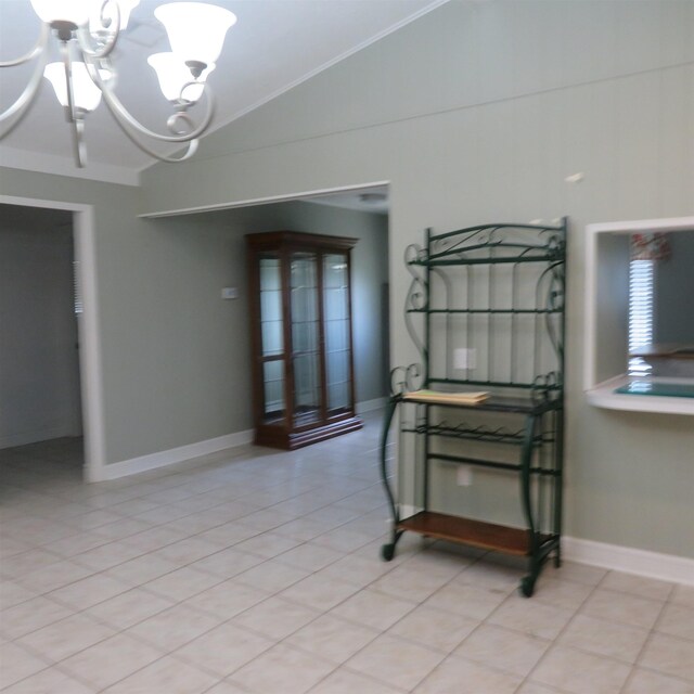 interior space featuring lofted ceiling, an inviting chandelier, baseboards, and light tile patterned flooring