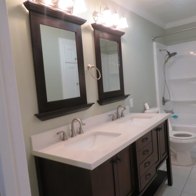 full bath with double vanity, tile patterned flooring, a sink, and toilet