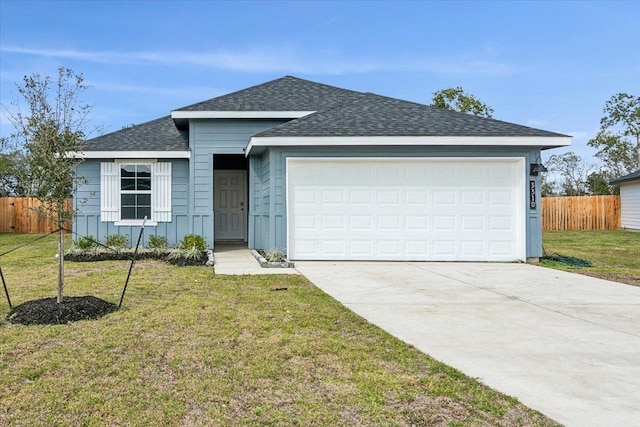 single story home with a front yard and a garage