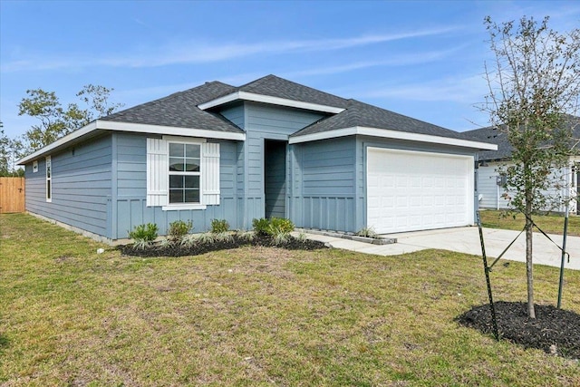 single story home with a garage and a front lawn