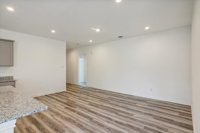 unfurnished living room with light wood-type flooring