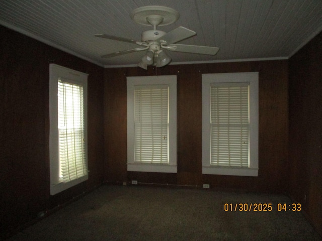 empty room with ornamental molding and ceiling fan