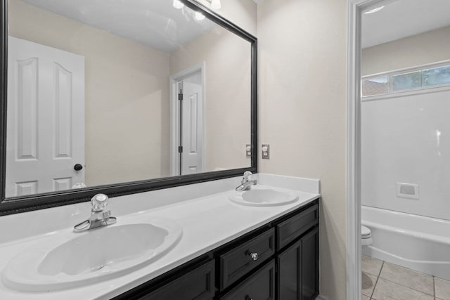 1424 Arbor Ct, Nederland, TX 77627 - bathroom featuring tile patterned floors, double vanity, and toilet