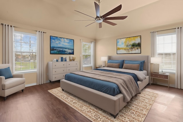 1424 Arbor Ct, Nederland, TX 77627 - bedroom featuring wood finished floors, multiple windows, baseboards, vaulted ceiling, and ceiling fan
