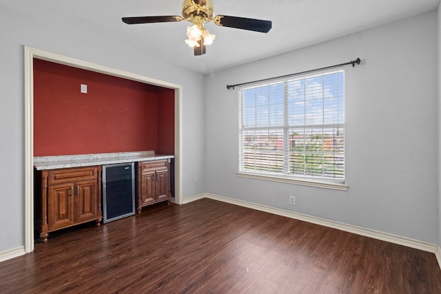 1424 Arbor Ct, Nederland, TX 77627 - indoor dry bar featuring wine cooler, dark wood-style flooring, and baseboards