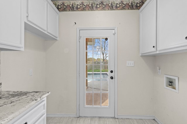 1424 Arbor Ct, Nederland, TX 77627 - clothes washing area with cabinet space, baseboards, and hookup for a washing machine