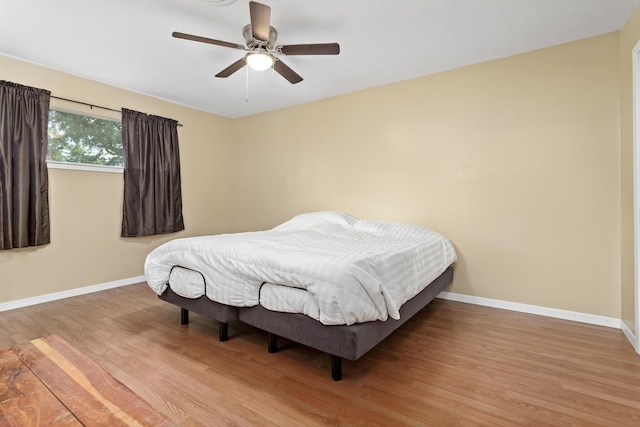 171 Ridgewood St, Bridge City, TX 77611 - bedroom with wood finished floors, baseboards, and a ceiling fan