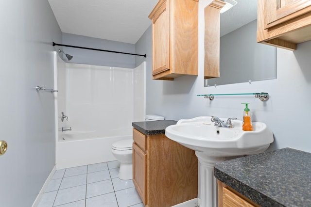 171 Ridgewood St, Bridge City, TX 77611 - bathroom featuring toilet, tub / shower combination, tile patterned floors, and baseboards