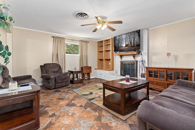 171 Ridgewood St, Bridge City, TX 77611 - living room featuring a ceiling fan, baseboards, crown molding, stone finish floors, and a fireplace