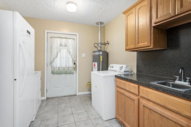 171 Ridgewood St, Bridge City, TX 77611 - washroom featuring water heater, light tile patterned flooring, cabinet space, a textured ceiling, and baseboards
