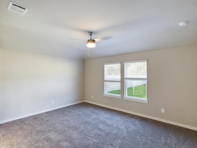 spare room featuring carpet flooring and ceiling fan