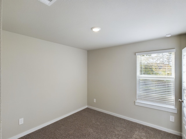 view of carpeted spare room